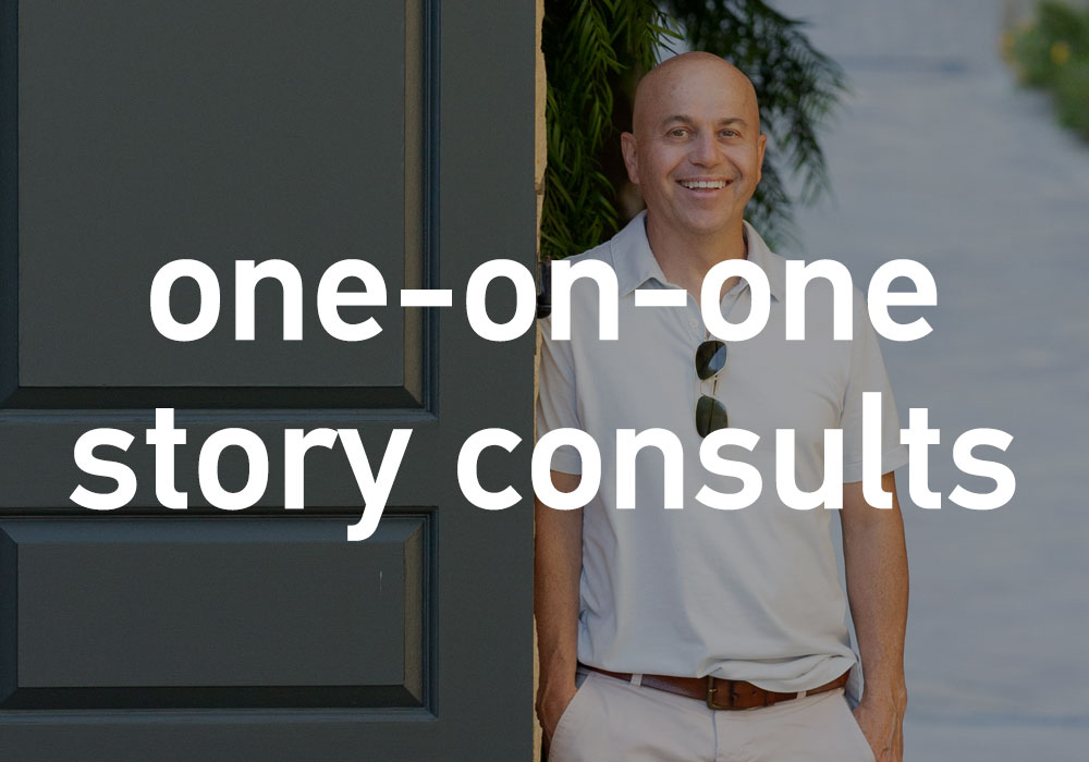 one-on-one story consults - Alan Watt standing by an open door smiling